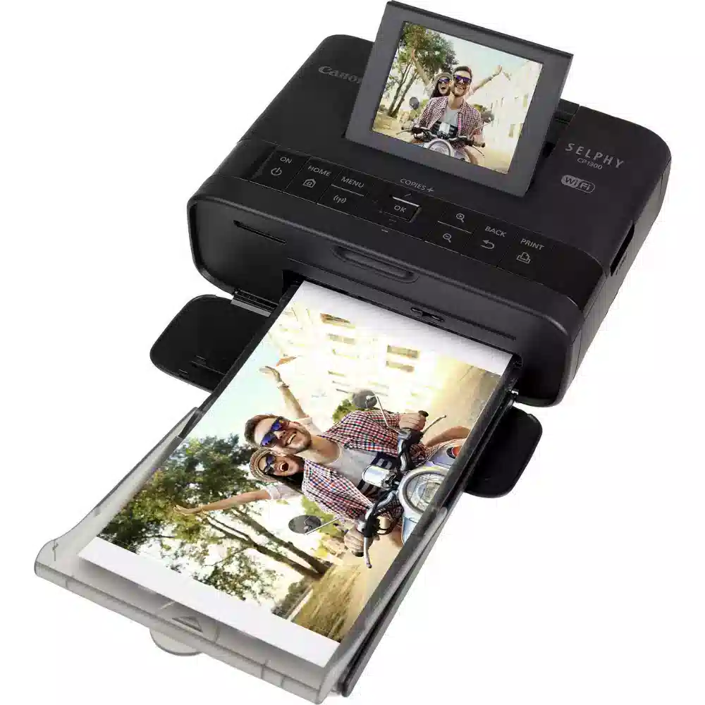 Canon crni photoselphy CP1300 za printanje fotografija s uključenom ladicom.